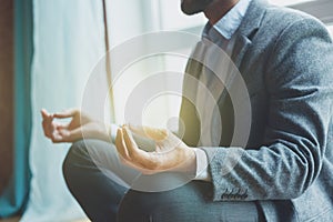 Businessman doing yoga