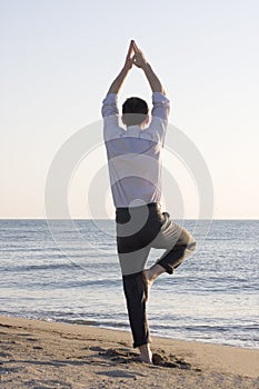 Businessman doing yoga