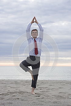 Businessman doing yoga