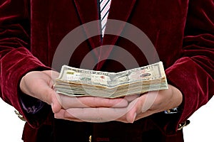 Businessman with dollars currency stack on hands