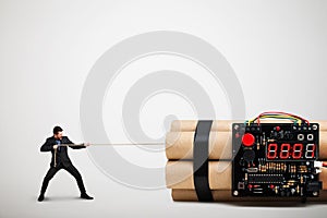 Businessman dragging big bomb with timer