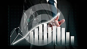 Businessman draw finance allusive graph chart showing business profit growth