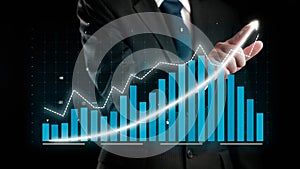 Businessman draw finance allusive graph chart showing business profit growth