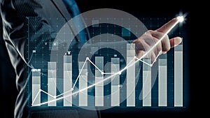 Businessman draw finance allusive graph chart showing business profit growth