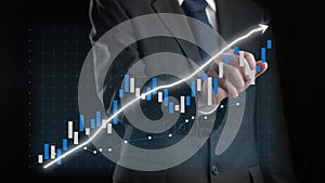 Businessman draw finance allusive graph chart showing business profit growth