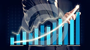 Businessman draw finance allusive graph chart showing business profit growth