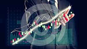 Businessman draw finance allusive graph chart showing business profit growth