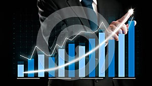 Businessman draw finance allusive graph chart showing business profit growth