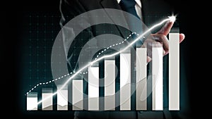 Businessman draw finance allusive graph chart showing business profit growth