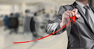 Businessman draw red curve line, business conceptual