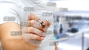 Businessman drawing GDPR law interface with a pen