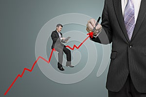 Businessman drawing growth red arrow and another sitting on it