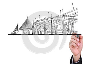 Businessman drawing highways. photo