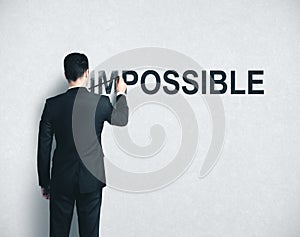 Businessman drawing impossible