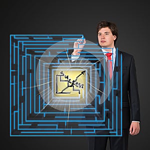 Businessman drawing labyrinth