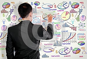 Businessman drawing modern business concept on white