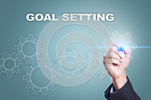 Businessman drawing on virtual screen. goal setting concept
