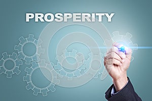 Businessman drawing on virtual screen. prosperity concept photo