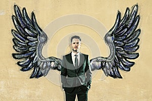 Businessman with drawn wings