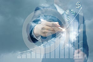 Businessman draws a graph of earnings growth .