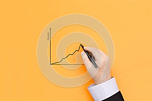 Businessman draws a graph of growth