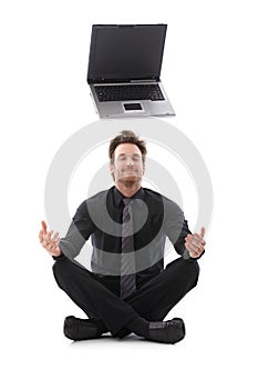 Businessman dreaming about a laptop