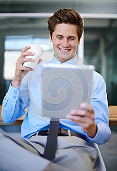 Businessman, drinking coffee and social media on break, tablet and internet connection for browsing. Male person