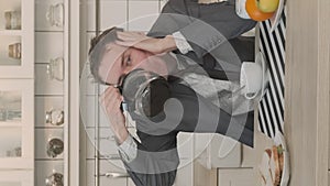 Businessman Drinking Out of Coffee Pot at Home