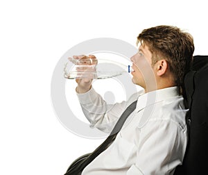 The businessman drinking water from a bottle