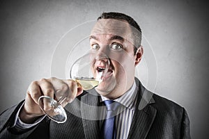 Businessman drinking wine