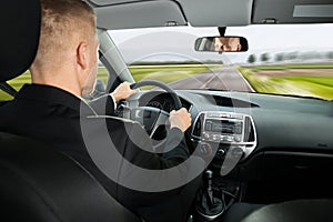 Businessman driving car