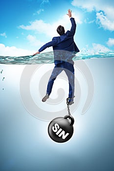 The businessman drowning under the burden of sin and guilt