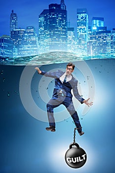 The businessman drowning under the burden of sin and guilt