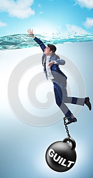 Businessman drowning under the burden of sin and guilt