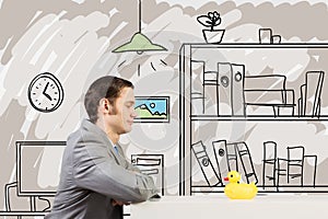 Businessman with duck