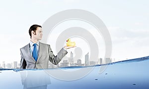 Businessman with duck