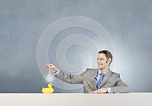 Businessman with duck