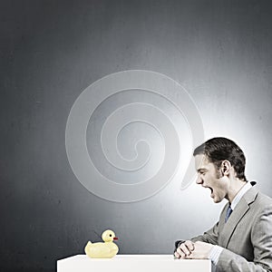 Businessman with duck