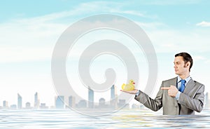 Businessman with duck