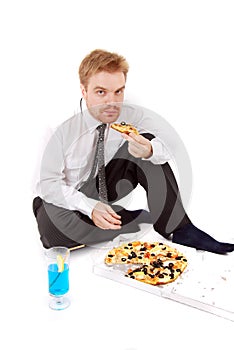 Businessman eat pizza photo