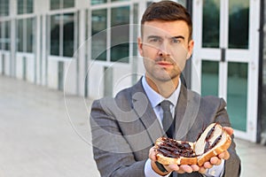 Businessman eating a high protein cockroach sandwich