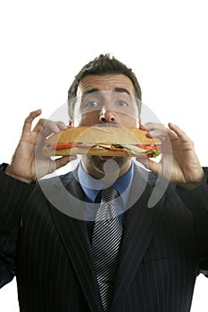 Businessman eating junk fast food