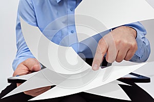 Businessman editing electronic documents concept