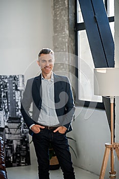 Businessman in an elegant suit looking confident and contented photo