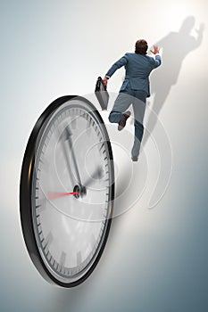 Businessman employee in time management concept