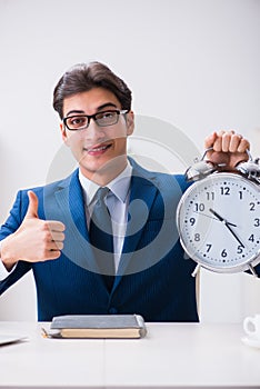 Businessman employee in urgency and deadline concept with alarm