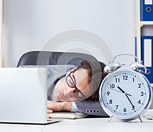 Businessman employee in urgency and deadline concept with alarm