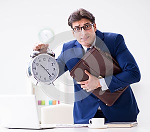 Businessman employee in urgency and deadline concept with alarm