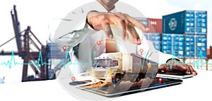 Businessman employing tablet for logistic network distribution and smart transportation, networking intelligent logistics of truck photo