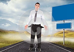 Businessman with empty pockets standing on road by blank signs